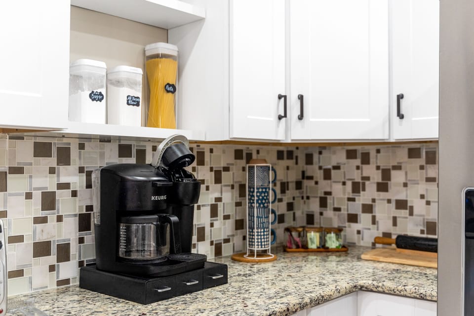 Complete with a sleek coffee maker for that perfect morning brew.