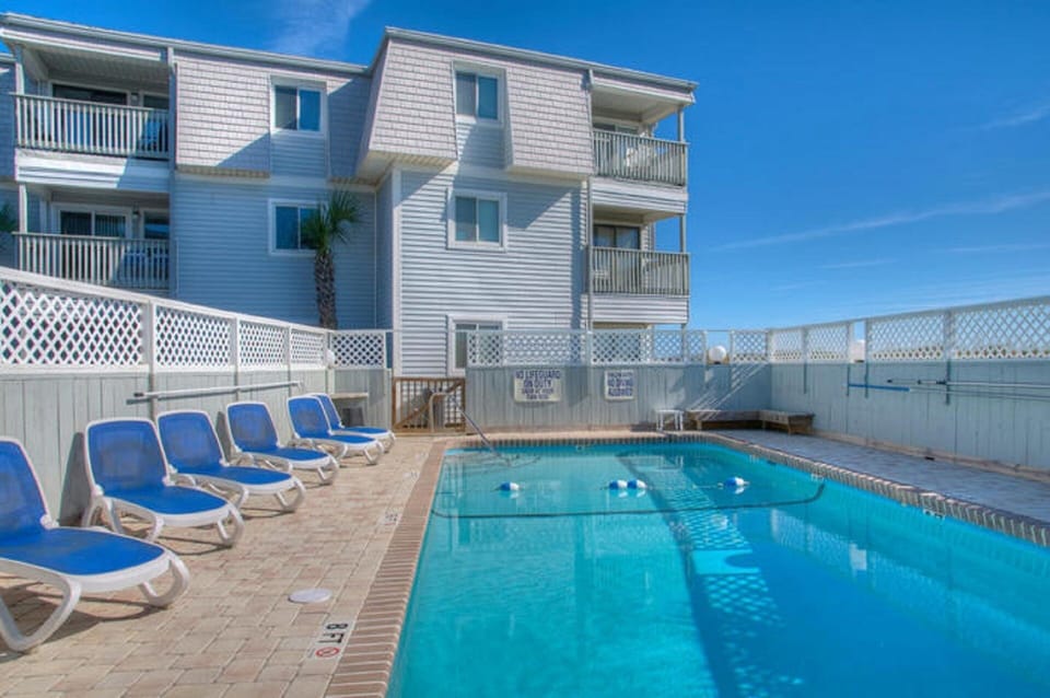 Relax in the lounge chairs while the kids splash and play in the pool.