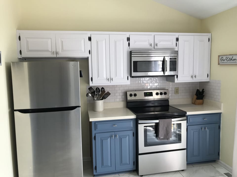 2nd floor kitchen area - stove, microwave and refrigerator