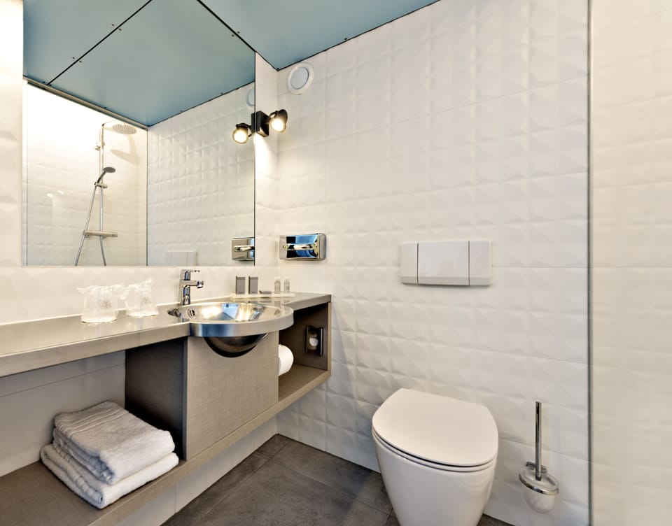 Shower, rainfall showerhead, hair dryer, towels