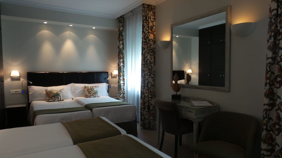 Quadruple Room | Down comforters, in-room safe, desk, blackout drapes