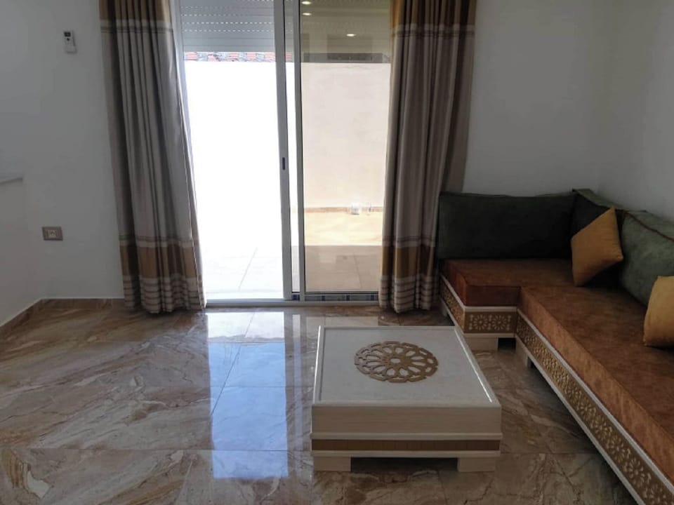 Apartment, 2 Bedrooms, Smoking, Balcony | Living area | Video-game console, books