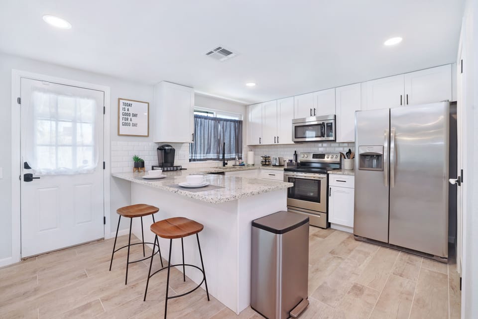 Bright open kitchen space with a breakfast bar