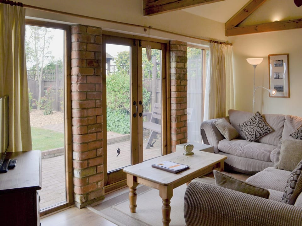 Living area | Sunflower Holiday Cottage, Thoresthorpe, near Alford