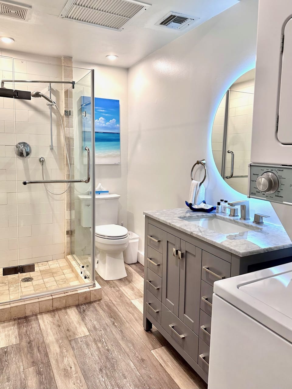 Main floor bathroom with washer/dryer and shower
