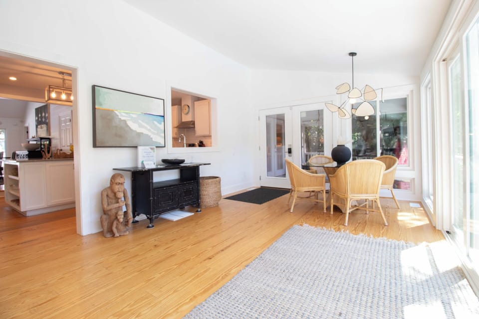 Step into your sun-drenched retreat with gleaming hardwood floors and airy open living space. Natural light floods through large windows, creating a warm, inviting atmosphere perfect for relaxing or gathering with loved ones.