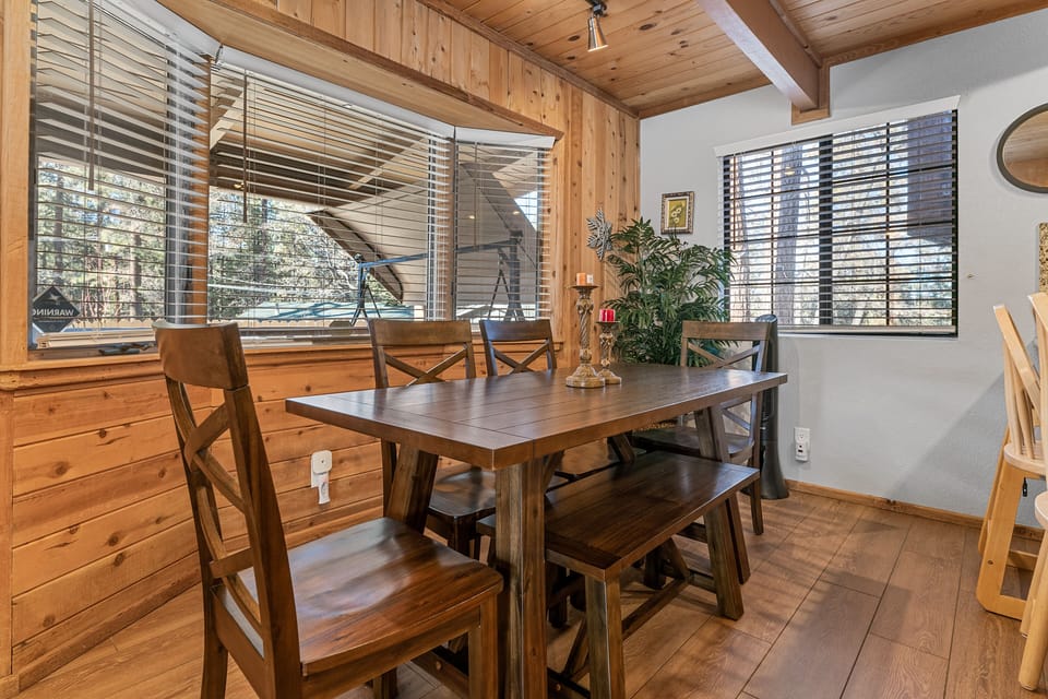Dinning Table seating for six, with additional high chair and bar stools.