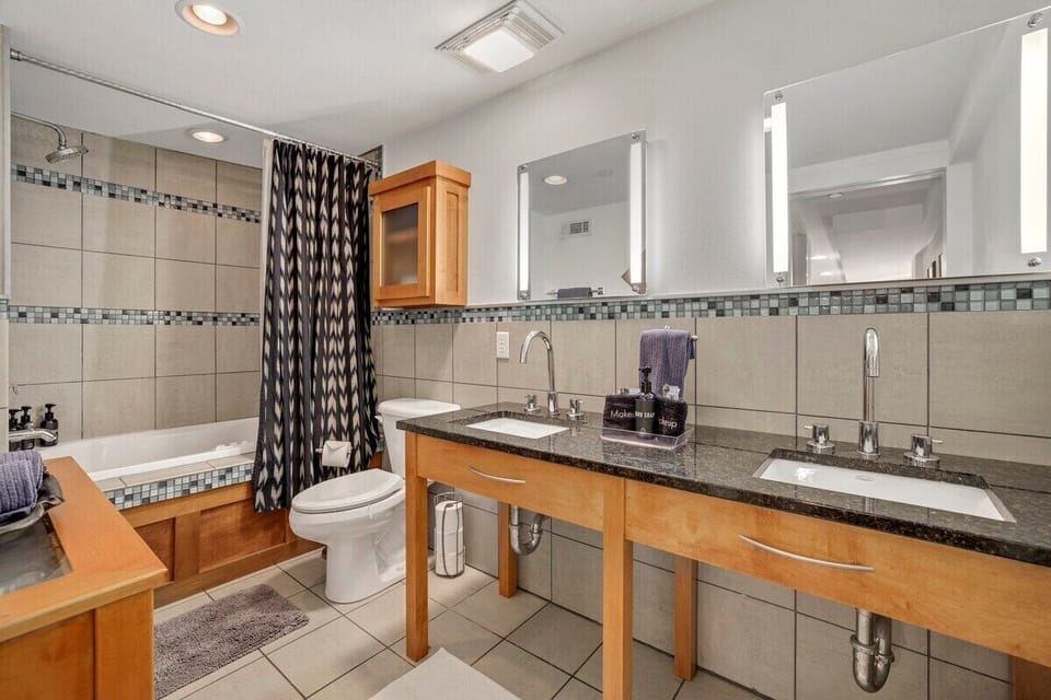 The master bath is complete with a spacious vanity and a jacuzzi tub + shower!