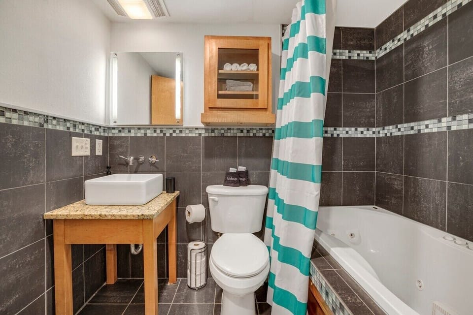 Our second bathroom also features a jacuzzi tub + shower for the ultimate bathing experience!