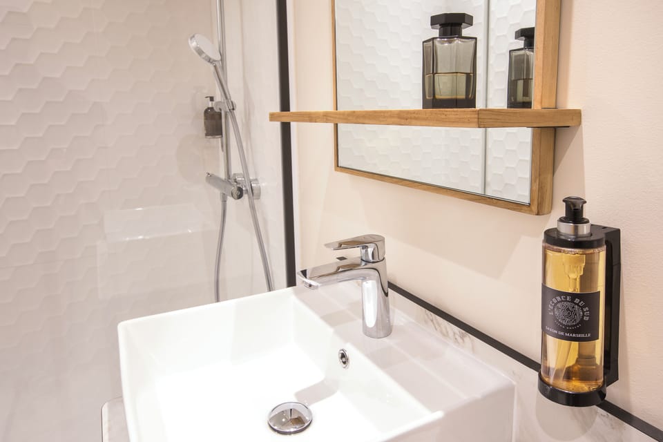 Shower, rainfall showerhead, eco-friendly toiletries, towels