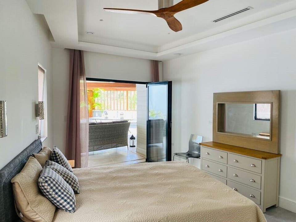 Bedroom 2 with bifold doors to sun deck.