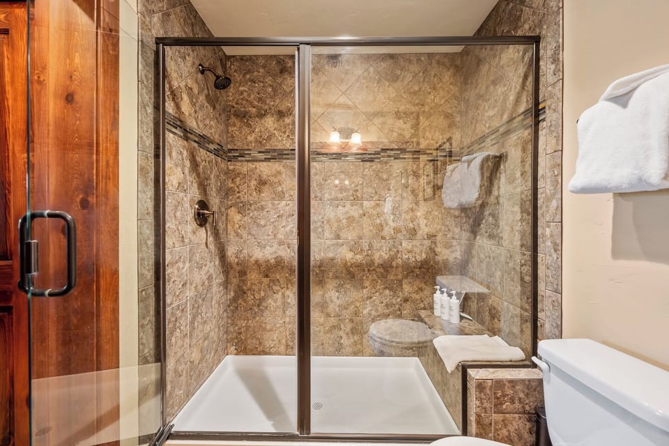 A spacious and stylish  shower attached to primary bedroom