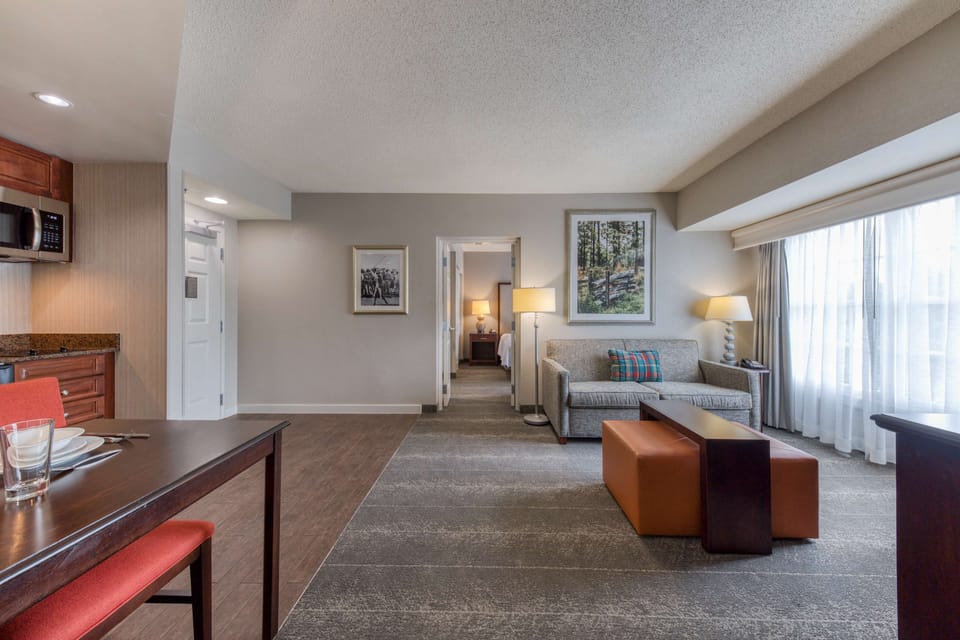 Suite, 2 Bedrooms, Non Smoking, 2 Bathrooms (1 King or 2 Queen Beds) | Living area | Flat-screen TV, pay movies