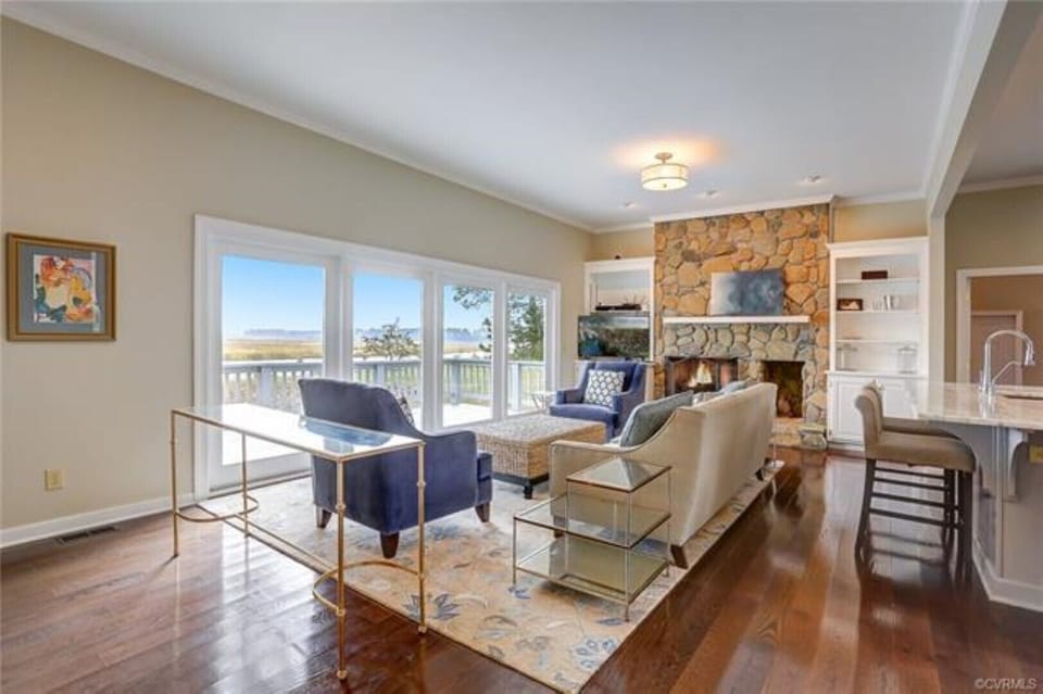 Living area overlooking the river - we have added a 75' TV over the fireplace