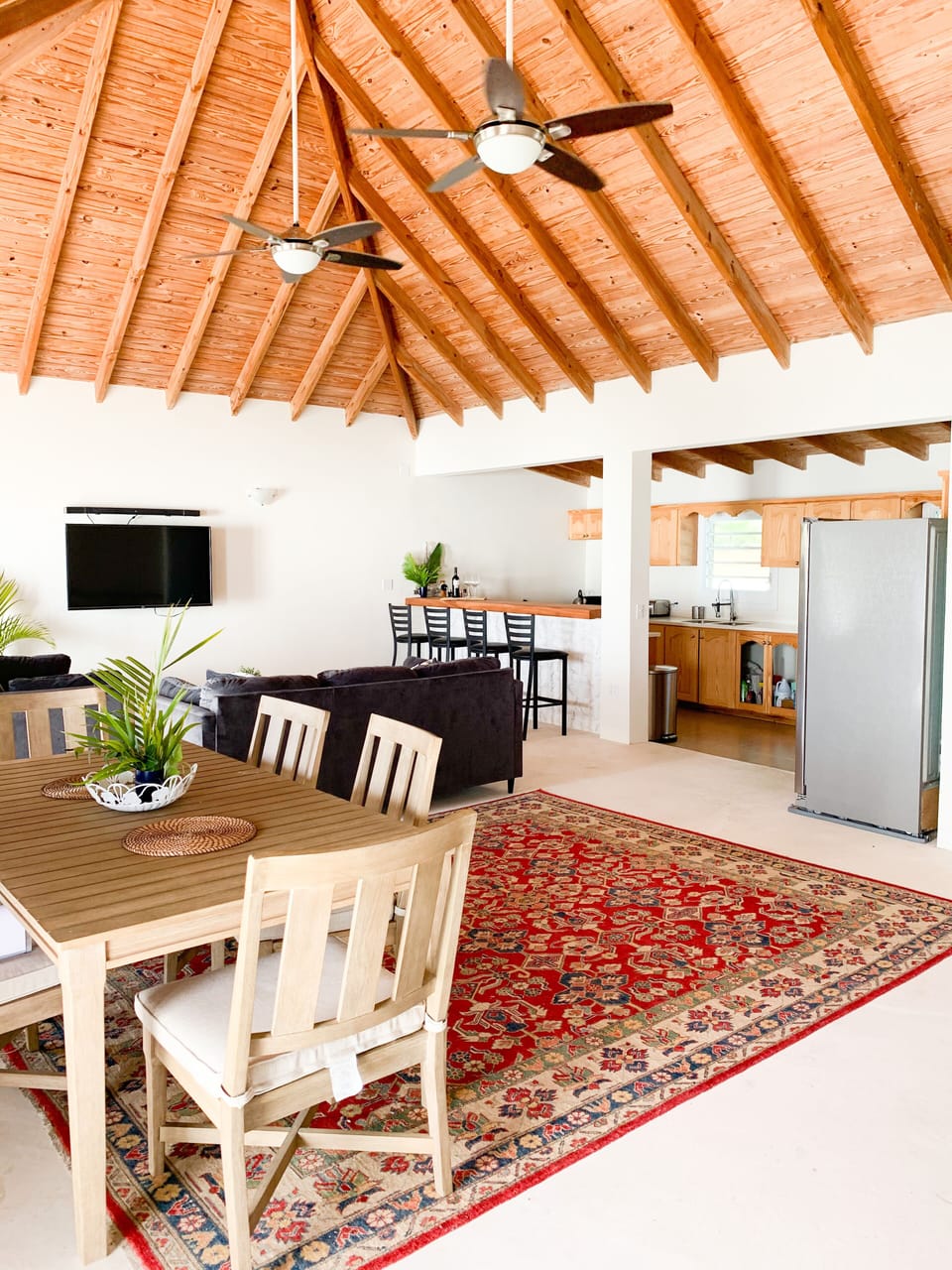 View of the dining table, living room and kitchen upstairs..