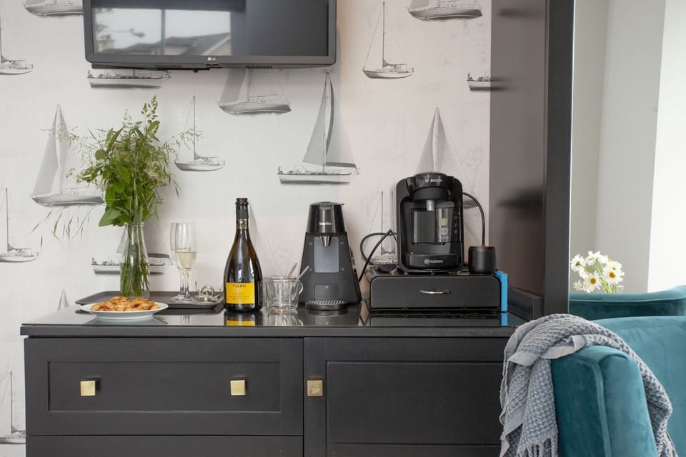 Tea and Coffee station with undercounter fridge and storage - Golden Vanity Suite