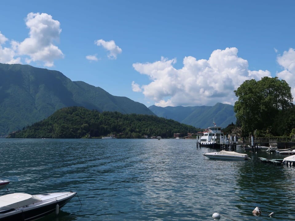 Cloud, Water, Sky, Boat, Water Resources, Mountain, Watercraft, Highland, Tree, Lake