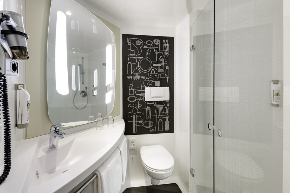 Shower, eco-friendly toiletries, hair dryer, towels