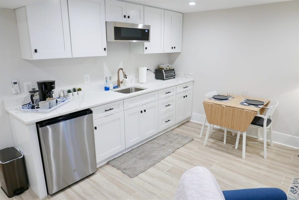 Kitchen includes a mini fridge, toaster oven, coffee maker and more