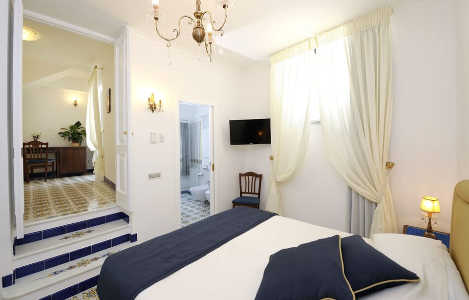 Classic Double Room | Minibar, in-room safe, desk, laptop workspace