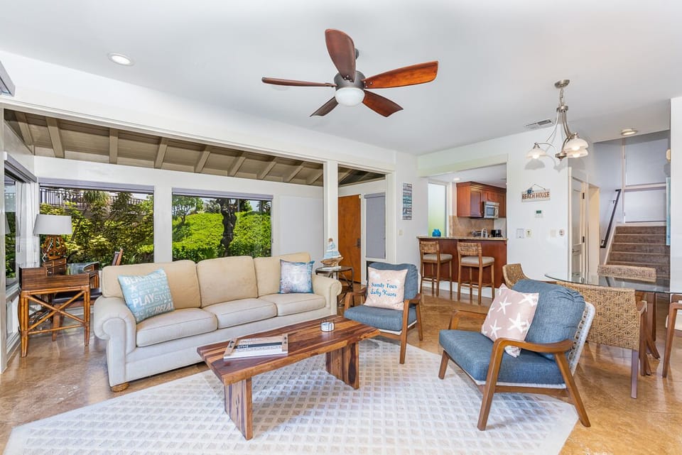 Cozy indoor-outdoor space with comfortable seating and patio access.