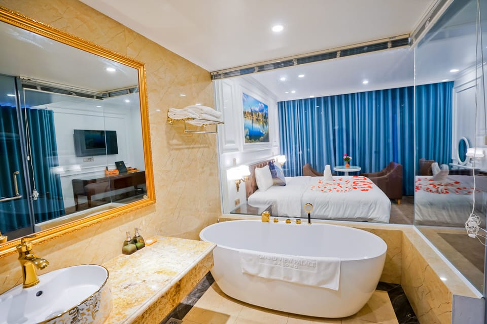 Deluxe Room, Beach View | Minibar, in-room safe, laptop workspace, soundproofing