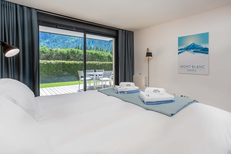 Master bedroom with ensuite and patio doors