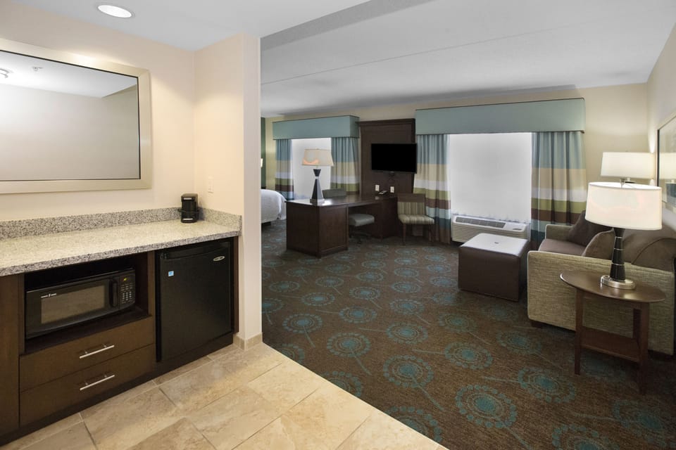 Suite, 1 King Bed | Desk, laptop workspace, blackout drapes, iron/ironing board