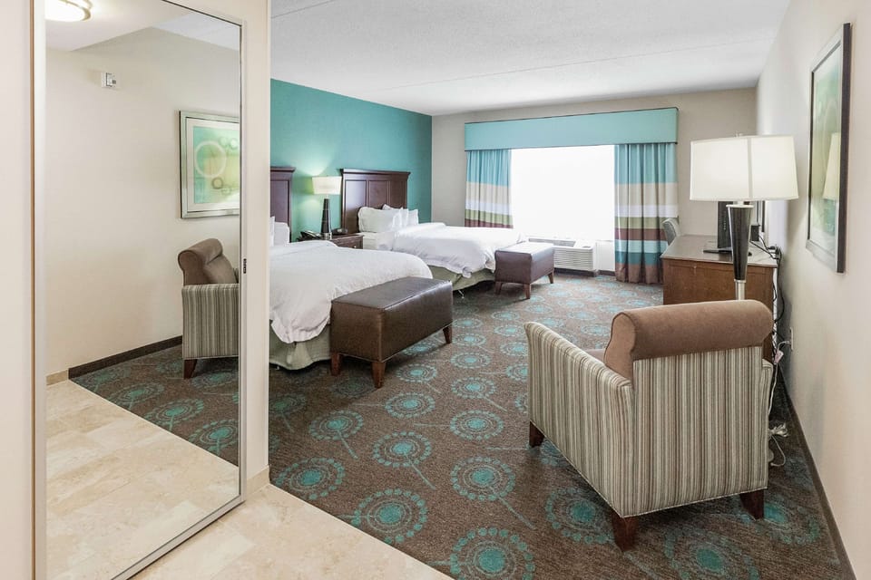 Room, 2 Queen Beds | Living area | 42-inch LED TV with digital channels, TV