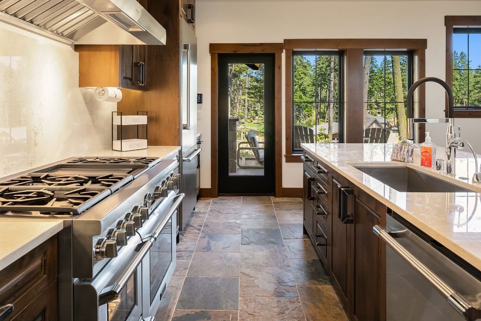 Fit for a King: - Fabulous kitchen with granite counters and a large gas cooktop.
