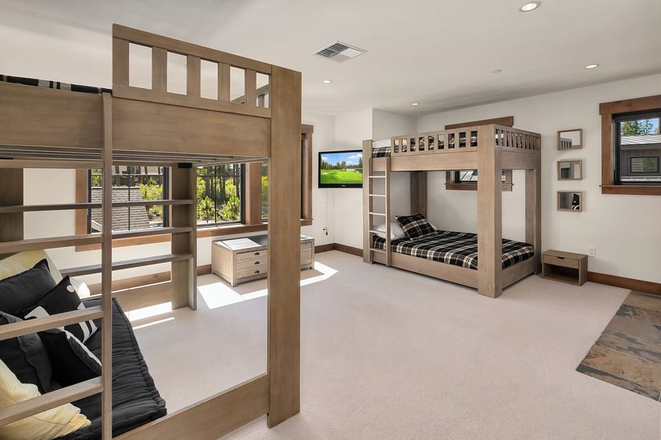 Fit for a King: - Bonus room with 3 double beds, and an area for the kid's to hang out and watch their favorite show or team.