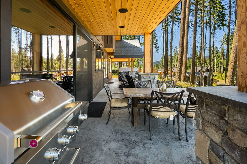 Fit for a King: - BBQ area with an outdoor dining table.