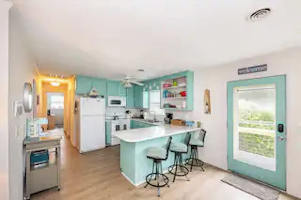 3 barstools for added seating. Keurig & Coffee Pot, Toaster, Blender, Microwave.