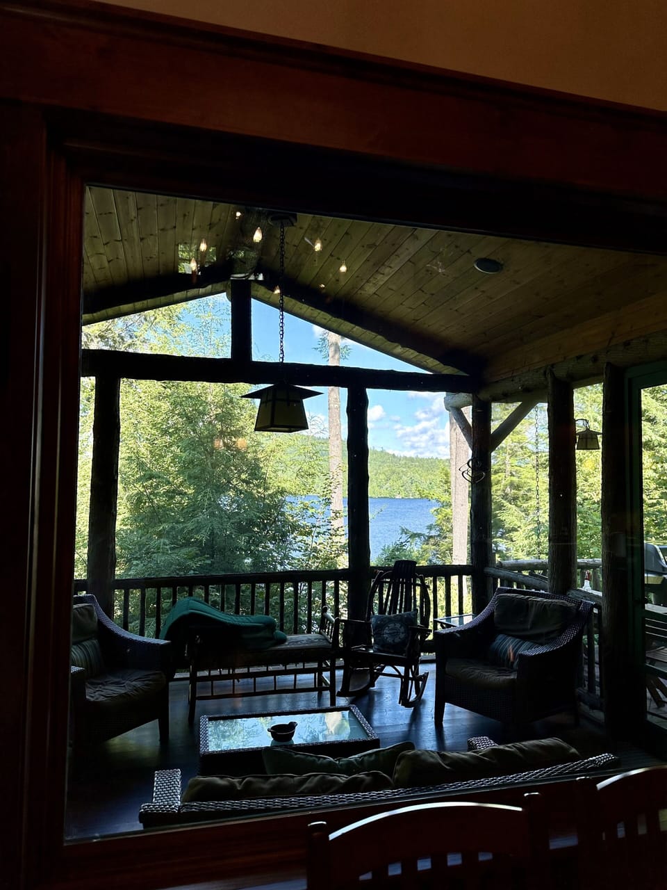 Large windows are all about the view (looking out through the screened porch).