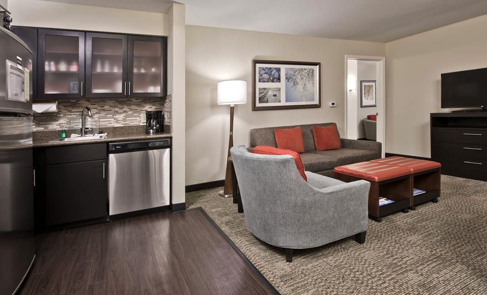 Premium bedding, desk, laptop workspace, blackout drapes