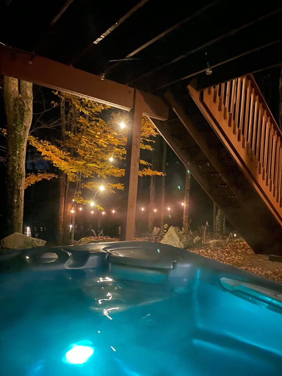 Relax in the hot tub overlooking the woods