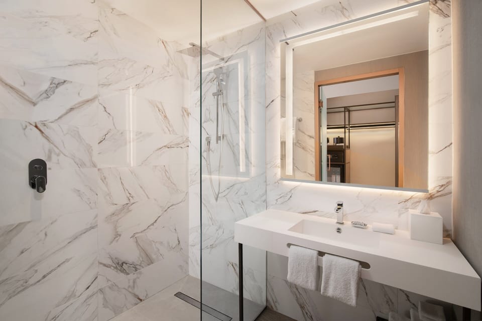 Shower, rainfall showerhead, designer toiletries, hair dryer