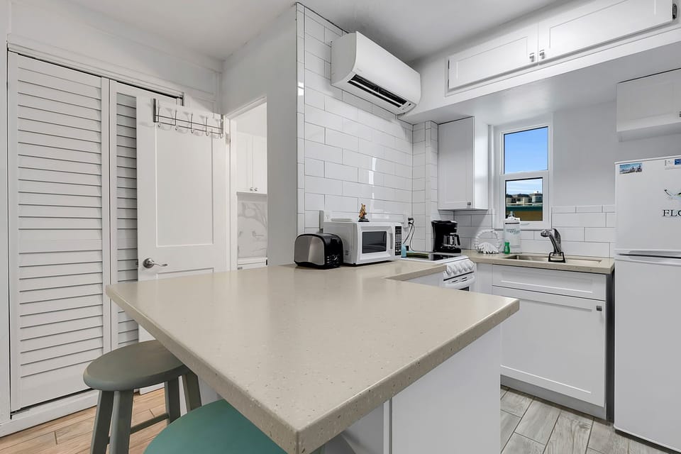 The kitchen is equipped with essentials to whip up breakfast or beach snacks.