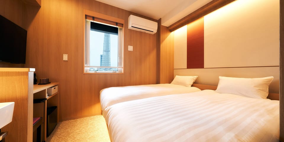 Twin Room, Separated Bath and Toilet, Non Smoking | Blackout drapes, free WiFi, bed sheets
