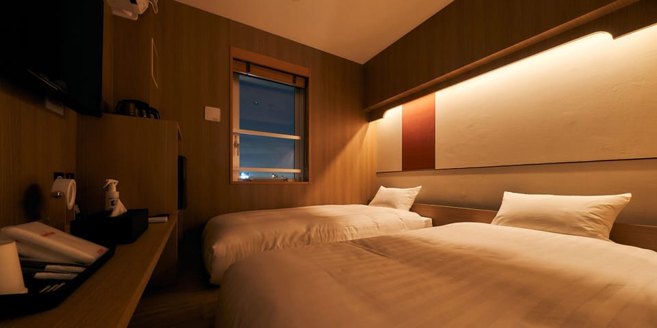 Twin Room, Non Smoking | Blackout drapes, free WiFi, bed sheets