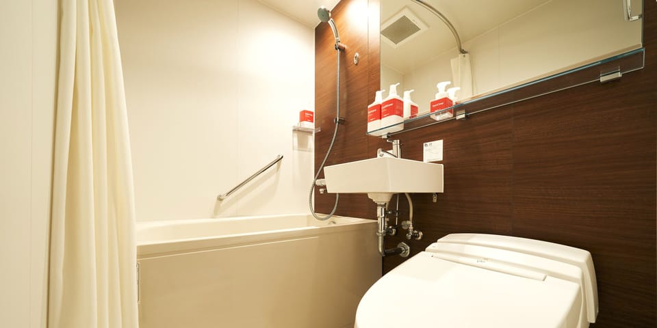 Free toiletries, hair dryer, slippers, electronic bidet