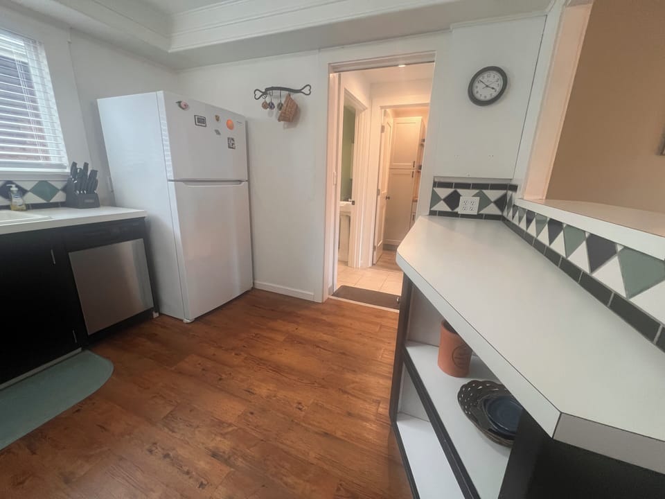 Step into your charming kitchen where exposed beams meet modern convenience—complete with appliances and thoughtful touches for easy meal prep.