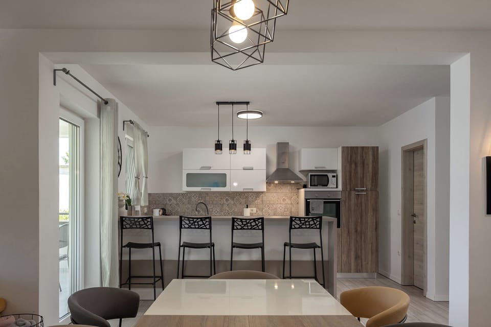 Villa | Private kitchen | Fridge, microwave, oven, stovetop