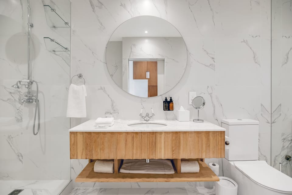 Designer toiletries, hair dryer, towels