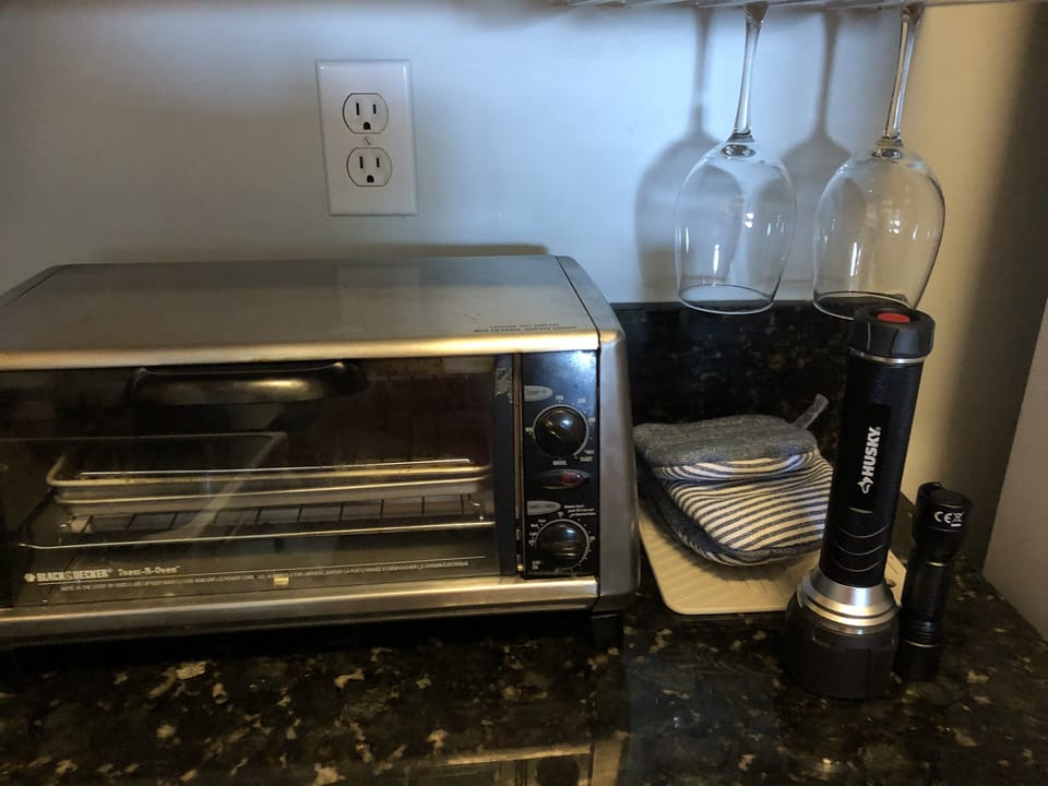 Toaster, toaster oven, inside grill 
Variety of plastic, glassware, & cookware.