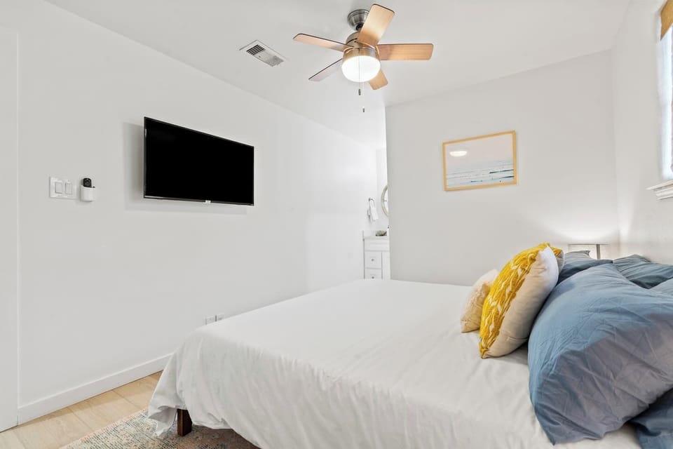 Cozy king bedroom with smart TV and private en-suite—perfect for restful nights and slow mornings.