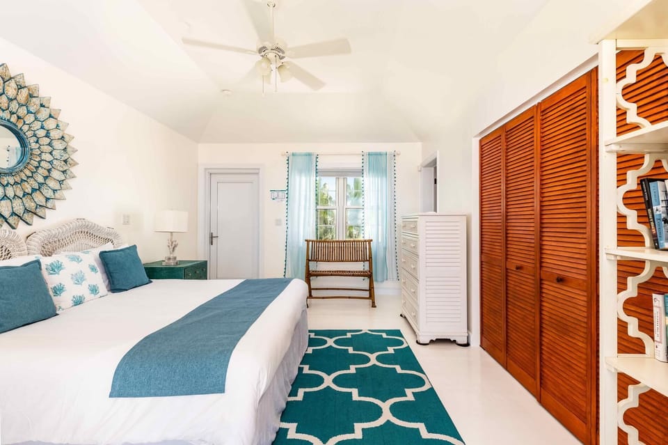 Upstairs bedroom with seating area.