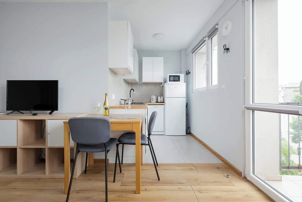 Functional combination of living and kitchen area.