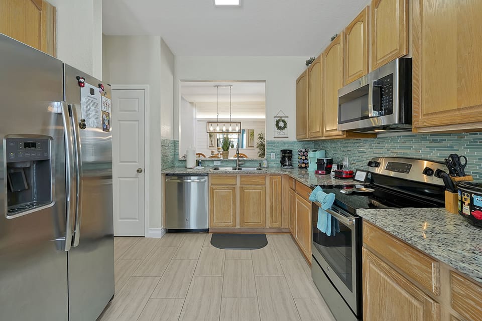 Well equipped Kitchen including Keurig, Mickey waffle maker & charcuterie board & Pixar crockpot