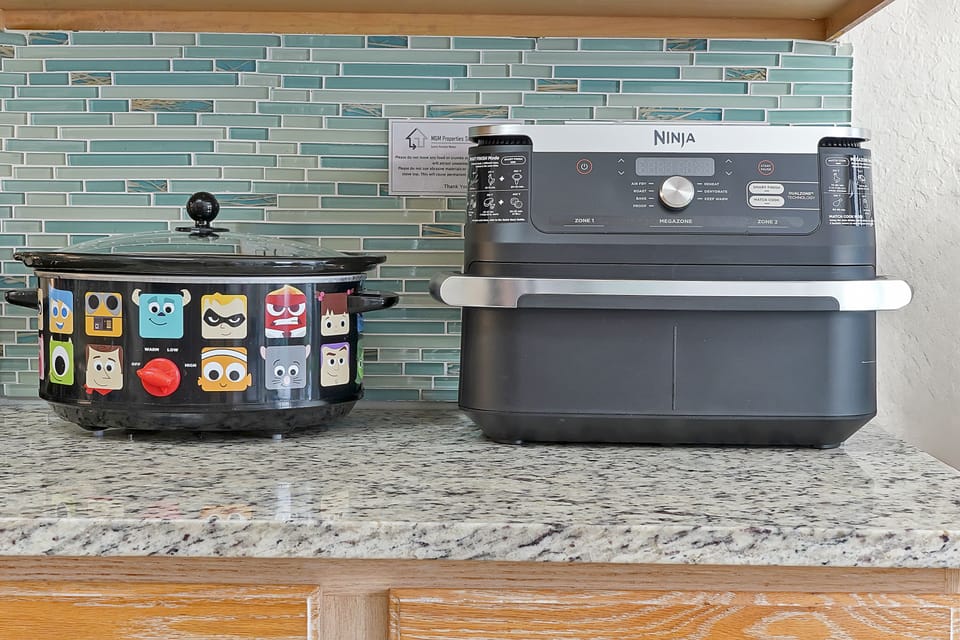 Sea Glass tile backsplash gives all the Florida vibes! Guests will find touches of Disney magic throughout the villa!